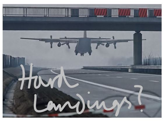 A plane landing on a german autobahn - with the words 'hard landings?' in hand writing