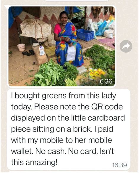 India - vegetable seller who accepts payments into her digital wallet